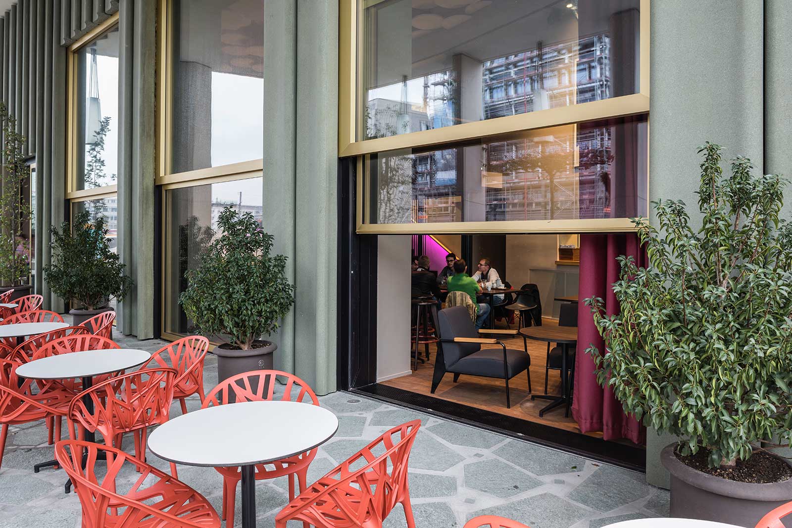 Where the avenue reaches into the interior space.